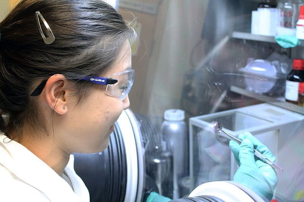Scientist using a glovebox