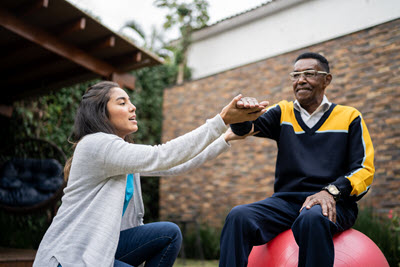 Parkinson's specialist uses balance and physical therapy for Parkinson's patient