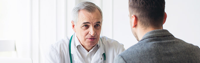 Legacy doctor tells patient about colon cancer risks