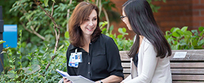 Legacy doctor talking with patient