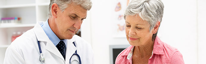 Colon cancer doctor showing patient paperwork