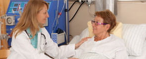 Doctor oncology discusses treatment with patient