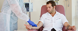 Nurse preparing patient for chemotherapy