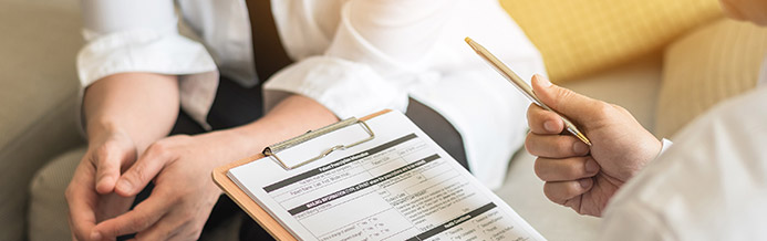 Gynecologist talking to patient about cervical cancer treatments