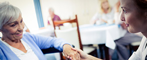 Legacy doctor and patient holding hands for healing