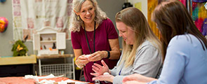 Art therapist and two patients make crafts