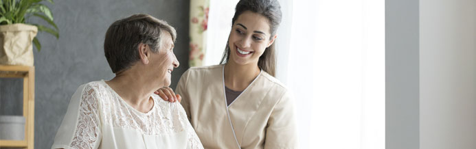 Therapist and patient walk through the hall