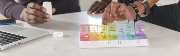 People sorting medicine during telehealth consultation