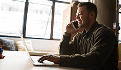 Transgender patient look at insurance information on laptop