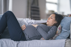 Pregnant woman on couch