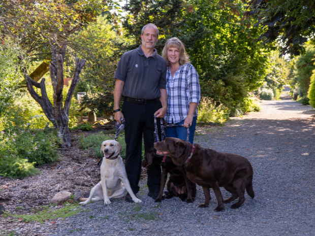 Photo of Richard Blake and wife Angela Blake along with two pet dogs