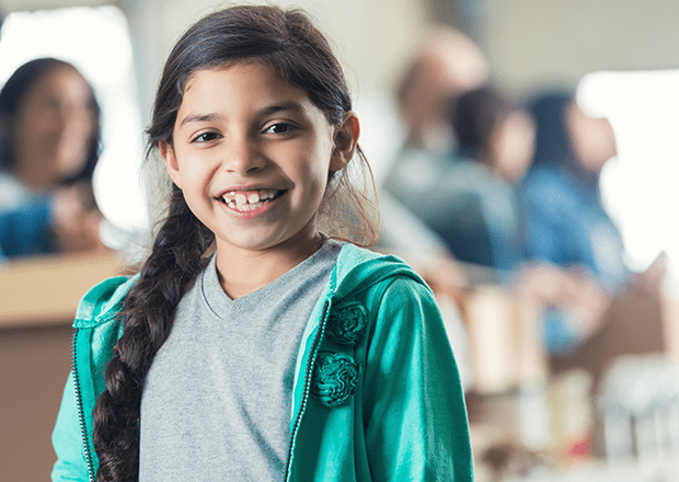 Girl in community doing volunteer work with team