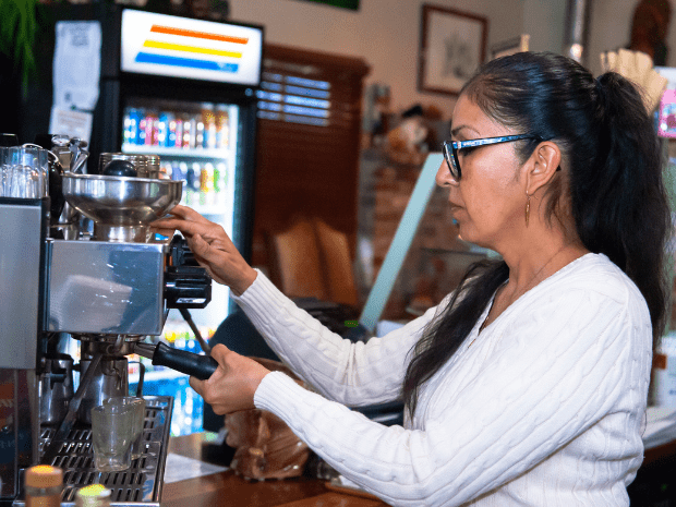 Loretta Guzman preparing coffee